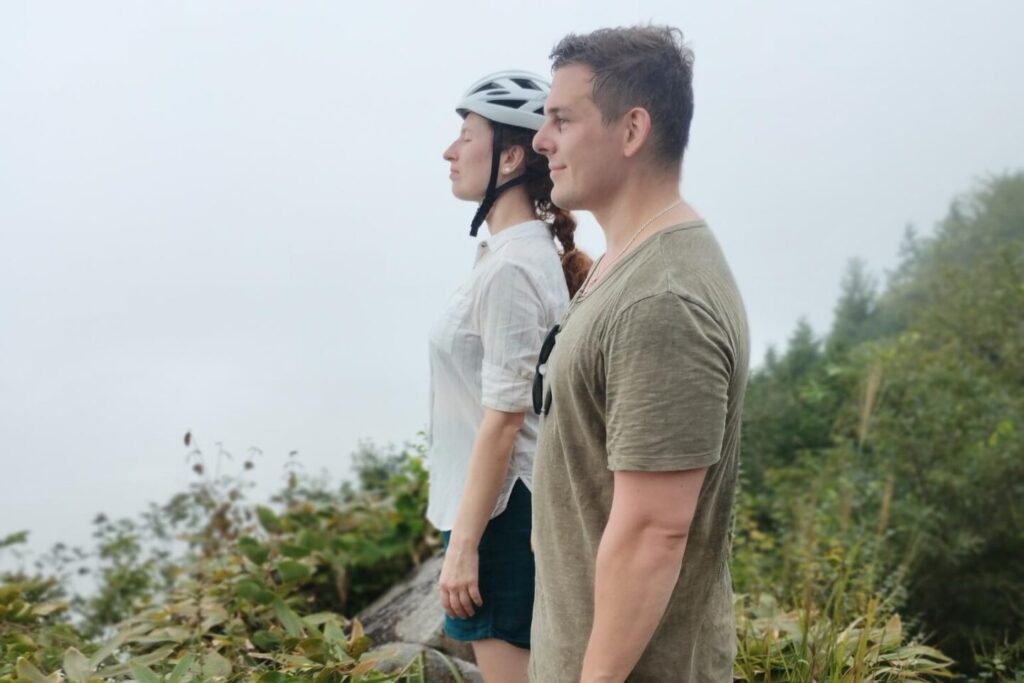 A couple enjoying a warm and refreshing summer shower in Oasa.